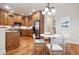 Bright kitchen with stainless steel appliances and hardwood flooring and breakfast nook with seating for four at 1907 S Columbine St, Denver, CO 80210