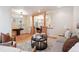 Open-concept living room with wood floors and decorative columns, offering a seamless transition to the dining area at 1907 S Columbine St, Denver, CO 80210