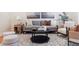 Cozy living room featuring modern furniture, soft lighting, and a decorative rug, perfect for relaxation at 1907 S Columbine St, Denver, CO 80210