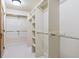 Bright and spacious walk-in closet with ample shelving and rod space for organized storage at 1907 S Columbine St, Denver, CO 80210