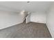 A bright and open basement with neutral paint and carpet at 8199 Welby Rd # 1908, Denver, CO 80229