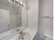 Clean bathroom featuring a sink, vanity, and well-lit mirror at 8199 Welby Rd # 1908, Denver, CO 80229