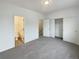 Bright bedroom with a carpeted floor, closet, and ensuite bathroom at 8199 Welby Rd # 1908, Denver, CO 80229