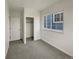 Cozy carpeted bedroom with closet, window, and neutral walls at 8199 Welby Rd # 1908, Denver, CO 80229
