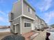 Inviting townhome with neutral siding, a well-kept lawn, and a driveway at 8199 Welby Rd # 1908, Denver, CO 80229