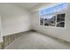 Bright living room with large windows and neutral carpeting at 8199 Welby Rd # 1908, Denver, CO 80229
