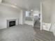 Inviting living room featuring a cozy fireplace and access to a modern kitchen and stairs at 8199 Welby Rd # 1908, Denver, CO 80229
