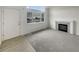 Bright living room features large windows and fireplace with carpet and laminate flooring at 8199 Welby Rd # 1908, Denver, CO 80229