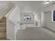 Inviting open living room with staircase and lots of natural light at 8199 Welby Rd # 1908, Denver, CO 80229