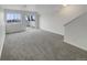 Open living room with neutral paint and sliding door to patio at 8199 Welby Rd # 1908, Denver, CO 80229