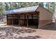 Exterior shot of the barn with multiple stalls for animals at 133 Mine Ln, Boulder, CO 80302