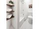A modern bathroom design with a tiled floor, tub, and open shelving at 133 Mine Ln, Boulder, CO 80302
