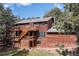Rear exterior of the home showing the private decks with access to multiple rooms and levels at 133 Mine Ln, Boulder, CO 80302