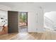 Bright foyer featuring wood floors, high ceilings, and a view of the outdoor landscape at 133 Mine Ln, Boulder, CO 80302