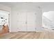 Bright foyer featuring wood floors, high ceilings, and a staircase to the upper level at 133 Mine Ln, Boulder, CO 80302