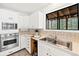 Kitchen with stainless steel appliances, breakfast bar, and a view of the outdoor scenery at 133 Mine Ln, Boulder, CO 80302