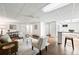 Expansive living room layout with a ceiling fan, a lounge area, and a bar with stools at 133 Mine Ln, Boulder, CO 80302