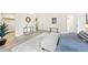 This bright main bedroom offers wood floors, a walk-in closet, and bench for comfort at 133 Mine Ln, Boulder, CO 80302