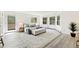 Bright main bedroom features large windows, wood floors, a bench, and access to the balcony at 133 Mine Ln, Boulder, CO 80302
