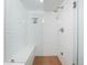 Bright shower with white subway tile, bench, and copper-colored mosaic tile at 133 Mine Ln, Boulder, CO 80302