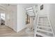 A modern white staircase with a large picture window bringing in plenty of natural light at 133 Mine Ln, Boulder, CO 80302