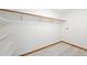 Simple yet functional walk-in closet design with bright walls, wood floors, and hanging racks at 133 Mine Ln, Boulder, CO 80302
