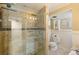 Bathroom with a glass shower, updated vanity, and natural light at 2876 S Wolff St, Denver, CO 80236