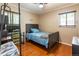 Bedroom with hardwood floors and natural light at 2876 S Wolff St, Denver, CO 80236