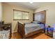 Comfortable bedroom features hardwood floors and a window that provides natural light at 2876 S Wolff St, Denver, CO 80236