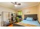 Bedroom with hardwood floors, natural light, and bed at 2876 S Wolff St, Denver, CO 80236