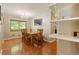 Bright dining area features a chandelier, window view, and a convenient bar area at 2876 S Wolff St, Denver, CO 80236