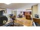 The in-home gym is adjacent to the living room which features a fireplace at 2876 S Wolff St, Denver, CO 80236