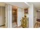 Hallway with hardwood flooring and a bathroom entrance at 2876 S Wolff St, Denver, CO 80236
