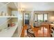 Open living room featuring hardwood floors, a bay window, and a cozy seating area at 2876 S Wolff St, Denver, CO 80236