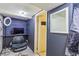 The home office offers ample lighting and custom shelving, perfect for a home based business at 2876 S Wolff St, Denver, CO 80236