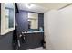 Room with mirror, hair dryer, and ample counter space at 2876 S Wolff St, Denver, CO 80236
