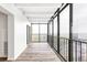 Bright balcony features floor-to-ceiling windows and wood-look flooring at 7877 E Mississippi Ave # 901, Denver, CO 80247