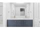 Bathroom features double sink vanity with modern fixtures and granite counter at 7877 E Mississippi Ave # 901, Denver, CO 80247