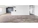 Open concept living area showcasing luxury vinyl plank floors, and breakfast bar at 7877 E Mississippi Ave # 901, Denver, CO 80247