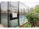 Community tennis court behind a black chain-link fence at 7877 E Mississippi Ave # 901, Denver, CO 80247