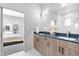 Elegant bathroom with a double vanity, sleek countertops, and a glass-enclosed walk-in shower at 9066 Harlan St, Westminster, CO 80031