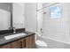 Modern bathroom with tiled shower/tub combination, sleek vanity, and ample natural light at 9066 Harlan St, Westminster, CO 80031