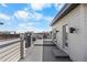 Expansive rooftop deck with contemporary railings offering views of the surrounding neighborhood at 9066 Harlan St, Westminster, CO 80031