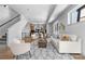 Bright living room with modern furniture and decor, flowing into the kitchen with stainless steel appliances at 9066 Harlan St, Westminster, CO 80031