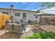 Relaxing backyard with stone patio and furniture at 2327 Lowell Blvd, Denver, CO 80211