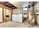 Basement laundry area with brick wall and water heater at 2327 Lowell Blvd, Denver, CO 80211