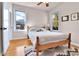 Bright bedroom with hardwood floors, large windows, and neutral decor at 2327 Lowell Blvd, Denver, CO 80211