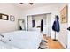 Cozy bedroom featuring hardwood floors, closet storage and minimalist decor at 2327 Lowell Blvd, Denver, CO 80211
