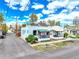 Charming home with a front porch and well-manicured landscaping at 2327 Lowell Blvd, Denver, CO 80211