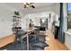 Open-concept living room and dining area featuring hardwood floors and abundant natural light at 2327 Lowell Blvd, Denver, CO 80211